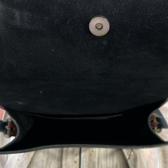 brown leather and features the gold-toned horsebit hardware.  B36 - Picture 8 of 9